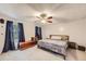 Tranquil bedroom with a comfortable bed, accent chest, and natural light from a window at 5241 E 111 Th Ct, Thornton, CO 80233