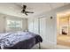 Clean bedroom showcasing a modern ceiling fan and a large window providing natural light at 5241 E 111Th Ct, Thornton, CO 80233