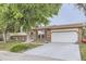 Well-maintained two-story home featuring a brick facade, attached two-car garage, and a neatly landscaped front yard at 5241 E 111Th Ct, Thornton, CO 80233