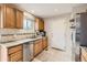 Functional kitchen featuring stainless steel appliances, granite countertops, and warm wood cabinetry at 5241 E 111 Th Ct, Thornton, CO 80233