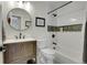 Bathroom featuring a single sink vanity, neutral wall color, and a shower over tub at 1692 Sand Lily Dr, Golden, CO 80401