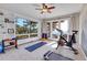 Bright exercise room with scenic mountain views, workout equipment, and ample natural light at 1692 Sand Lily Dr, Golden, CO 80401