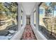 Bright hallway with floor to ceiling windows, and an orange patterned rug at 1692 Sand Lily Dr, Golden, CO 80401