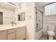 Bright bathroom with dual sinks, and shower over tub at 7440 S Blackhawk St # 15-202, Englewood, CO 80112