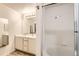 Well-lit bathroom with double sink vanity and shower-tub combo at 7440 S Blackhawk St # 15-202, Englewood, CO 80112