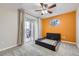 Bedroom with balcony, a fan, and interesting paint scheme at 7440 S Blackhawk St # 15-202, Englewood, CO 80112