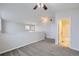 Spacious loft bedroom with vaulted ceiling and bathroom entrance at 7440 S Blackhawk St # 15-202, Englewood, CO 80112