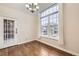 Cozy dining area with wood floors, chandelier, and a door to the exterior at 7440 S Blackhawk St # 15-202, Englewood, CO 80112