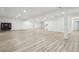 Expansive basement with stylish floors, ample lighting, and versatile open layout at 27196 E Alder Dr, Aurora, CO 80016