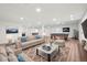 Finished basement featuring a large seating area, pool table, and recessed lighting at 27196 E Alder Dr, Aurora, CO 80016