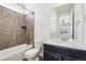 Cozy bathroom featuring a shower-tub combination, a toilet, and a granite-topped vanity at 27196 E Alder Dr, Aurora, CO 80016