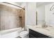Bathroom featuring tub shower, granite vanity top and lots of tile at 27196 E Alder Dr, Aurora, CO 80016