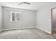 Bright bedroom featuring gray carpet, a ceiling fan, and a window with natural light at 27196 E Alder Dr, Aurora, CO 80016