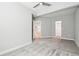 Bright bedroom with neutral walls, soft gray carpet, and an open doorway at 27196 E Alder Dr, Aurora, CO 80016