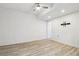 Bright bedroom featuring wood floors, a ceiling fan, and a closet at 27196 E Alder Dr, Aurora, CO 80016