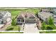 Charming two-story home with a three-car garage, landscaped yard, and inviting front porch at 27196 E Alder Dr, Aurora, CO 80016
