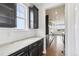 Modern kitchen with dark cabinets, granite countertops, stainless appliances and great natural light at 27196 E Alder Dr, Aurora, CO 80016