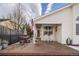 Backyard with deck and rocking chairs at 5935 E 129Th Pl, Thornton, CO 80602