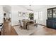 Bright dining room features a wood table, bench, and built-in hutch at 5935 E 129Th Pl, Thornton, CO 80602