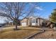 Brick ranch home with attached garage and landscaping at 5935 E 129Th Pl, Thornton, CO 80602