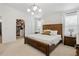 Main bedroom with walk-in closet and wood furniture at 5935 E 129Th Pl, Thornton, CO 80602