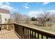 Cozy wooden deck overlooking a serene, grassy landscape at 7722 S Steele St, Centennial, CO 80122