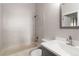 Bright bathroom featuring tiled shower/tub and modern sink vanity at 7722 S Steele St, Centennial, CO 80122