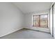 Bedroom featuring a large window with natural light and soft carpet at 7722 S Steele St, Centennial, CO 80122