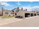 Spacious home with a three-car garage and a well-maintained front yard and landscaping at 7722 S Steele St, Centennial, CO 80122