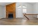 Cozy living room with a charming wooden fireplace and an inviting front entryway at 7722 S Steele St, Centennial, CO 80122