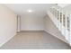 Spacious living room with neutral carpet and staircase at 7722 S Steele St, Centennial, CO 80122