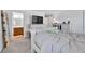 Bright bedroom with a neutral color palette, carpeted floors and an ensuite bathroom at 28304 E 6Th Pl, Watkins, CO 80137