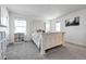 Carpeted main bedroom is bright and sunny with neutral paint at 28304 E 6Th Pl, Watkins, CO 80137