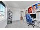 Bright room with a large window, carpeted floor, and modern gaming setup at 28304 E 6Th Pl, Watkins, CO 80137
