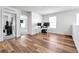 Bright and airy bedroom with wood floors, a large window, and neutral decor at 28304 E 6Th Pl, Watkins, CO 80137