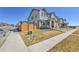 Well-manicured lawn on a beautiful townhome with sidewalk, fencing, and street views at 28304 E 6Th Pl, Watkins, CO 80137