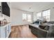 Bright living room with large windows and plenty of natural light at 28304 E 6Th Pl, Watkins, CO 80137