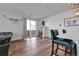 Spacious living area featuring hardwood floors and access to the backyard at 28304 E 6Th Pl, Watkins, CO 80137