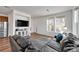 Comfortable living room with an entertainment center and open layout at 28304 E 6Th Pl, Watkins, CO 80137