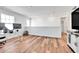 Upstairs loft with a computer, media center and wood floors at 28304 E 6Th Pl, Watkins, CO 80137