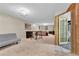 Spacious basement area featuring plush carpeting, a bar-style table, and a cozy seating area with a fireplace at 6434 S Dudley Way, Littleton, CO 80123