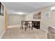 A basement with plush carpeting, bar style table, and neutral color walls, creating a cozy and inviting space at 6434 S Dudley Way, Littleton, CO 80123