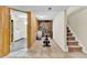 Basement features exercise area with equipment and laundry room access at 6434 S Dudley Way, Littleton, CO 80123