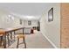 Spacious finished basement featuring a bar area, seating, and entertainment center at 6434 S Dudley Way, Littleton, CO 80123