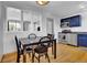 Eat-in kitchen features stainless appliances, ample cabinet space and wood flooring at 6434 S Dudley Way, Littleton, CO 80123
