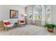 Bright living room with large arched windows, neutral tones, and stylish furnishings at 10470 W Cooper Pl, Littleton, CO 80127