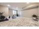 Spacious basement offers plenty of room for exercise equipment and includes carpeted floors at 6849 E Lowry Blvd, Denver, CO 80230