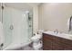 Contemporary bathroom with glass enclosed shower, modern vanity, and sleek fixtures at 6849 E Lowry Blvd, Denver, CO 80230