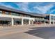 Modern shopping center featuring various stores, restaurants, and street-level parking at 6849 E Lowry Blvd, Denver, CO 80230