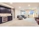 Spacious basement featuring a wet bar and a comfortable seating area, perfect for entertaining or relaxing at 555 Gallegos Cir, Erie, CO 80516